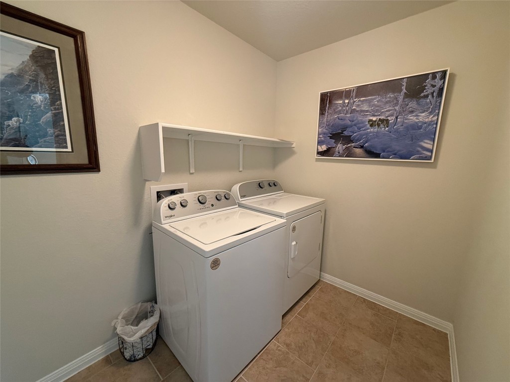 233 Hobby Street Georgetown, TX 78633 - Photo 5 of 13 a utility room with dryer and washer