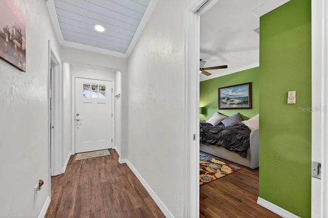 a view of a bedroom from a hallway