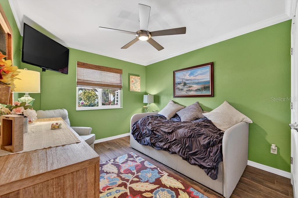 4719 Dixie Drive Ponce Inlet, FL 32127 - Photo 13 of 20 a bed room with a bed window and a flat screen tv