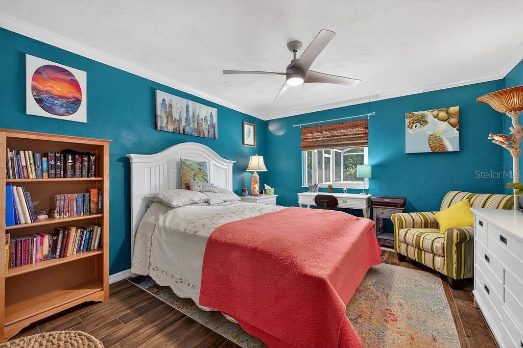 4719 Dixie Drive Ponce Inlet, FL 32127 - Photo 16 of 20 a bedroom with a bed furniture and a window