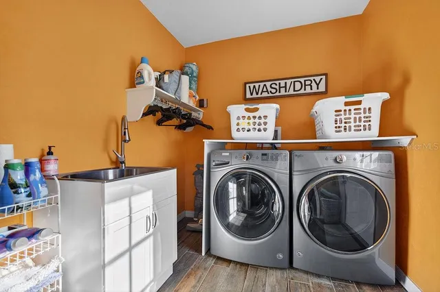 a utility room with dryer and washer