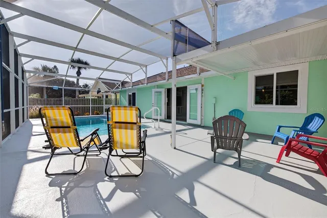 a view of a chairs and table in a patio