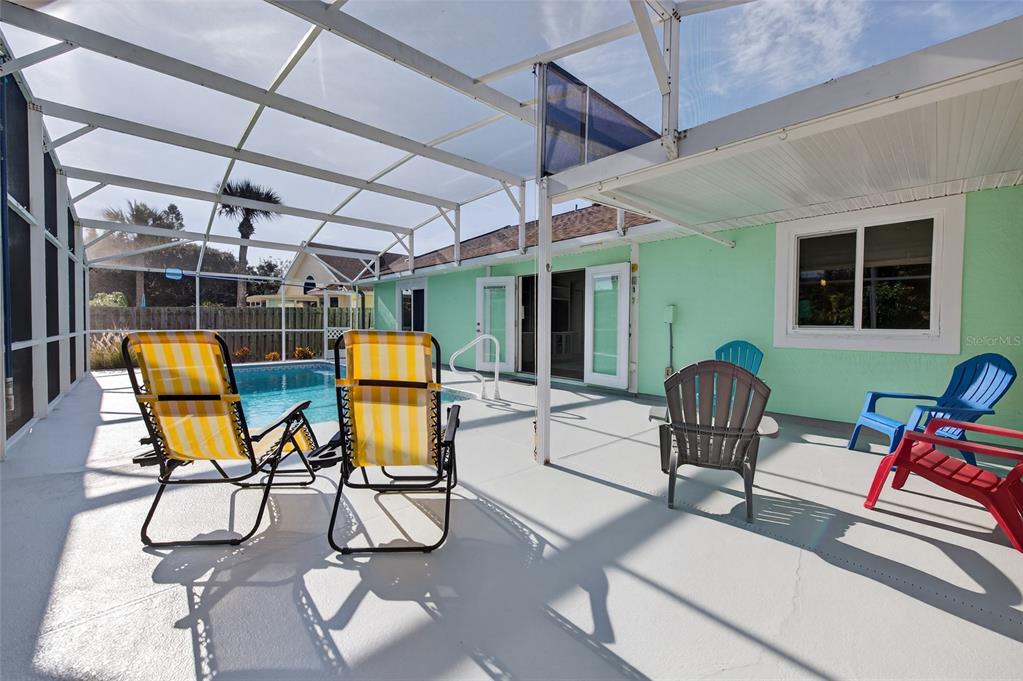 4719 Dixie Drive Ponce Inlet, FL 32127 - Photo 4 of 20 a view of a chairs and table in a patio