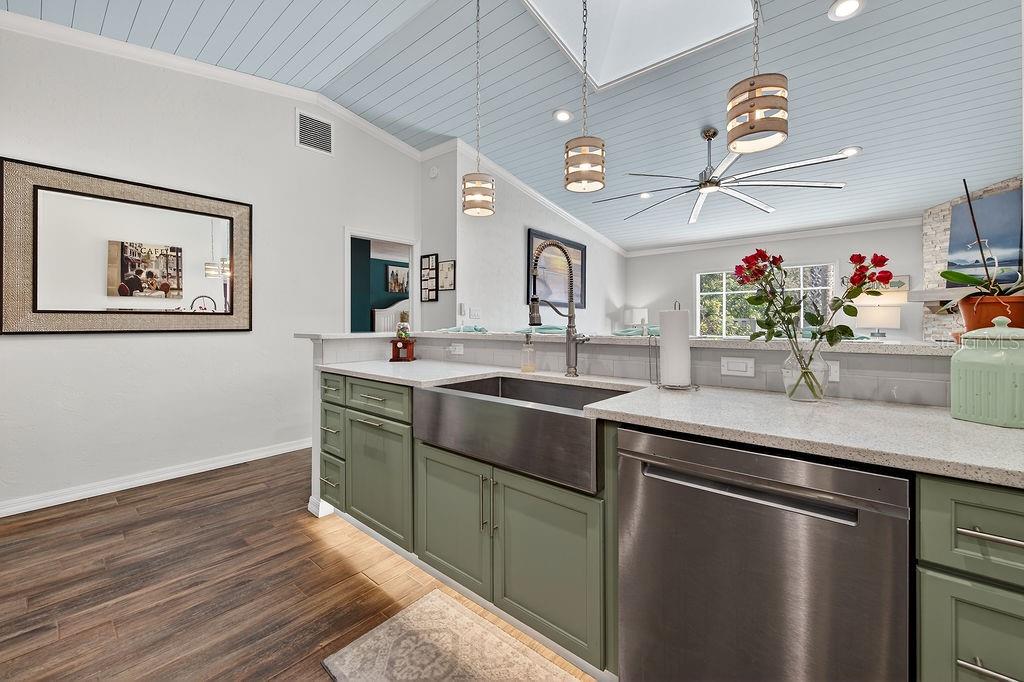 4719 Dixie Drive Ponce Inlet, FL 32127 - Photo 6 of 20 a kitchen with stainless steel appliances granite countertop a sink and a microwave