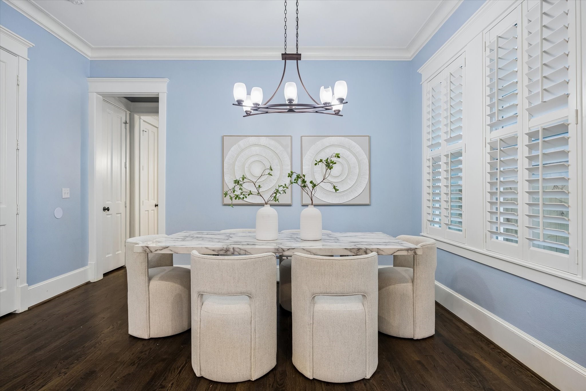 634 West 17th Street Houston, TX 77008 - Photo 8 of 42 The formal dining room is ready to host lavish dinner parties, holiday feasts, or more intimate gatherings, with wood shuttered windows, rich moldings, wood flooring, and a stylish chandelier overhead.