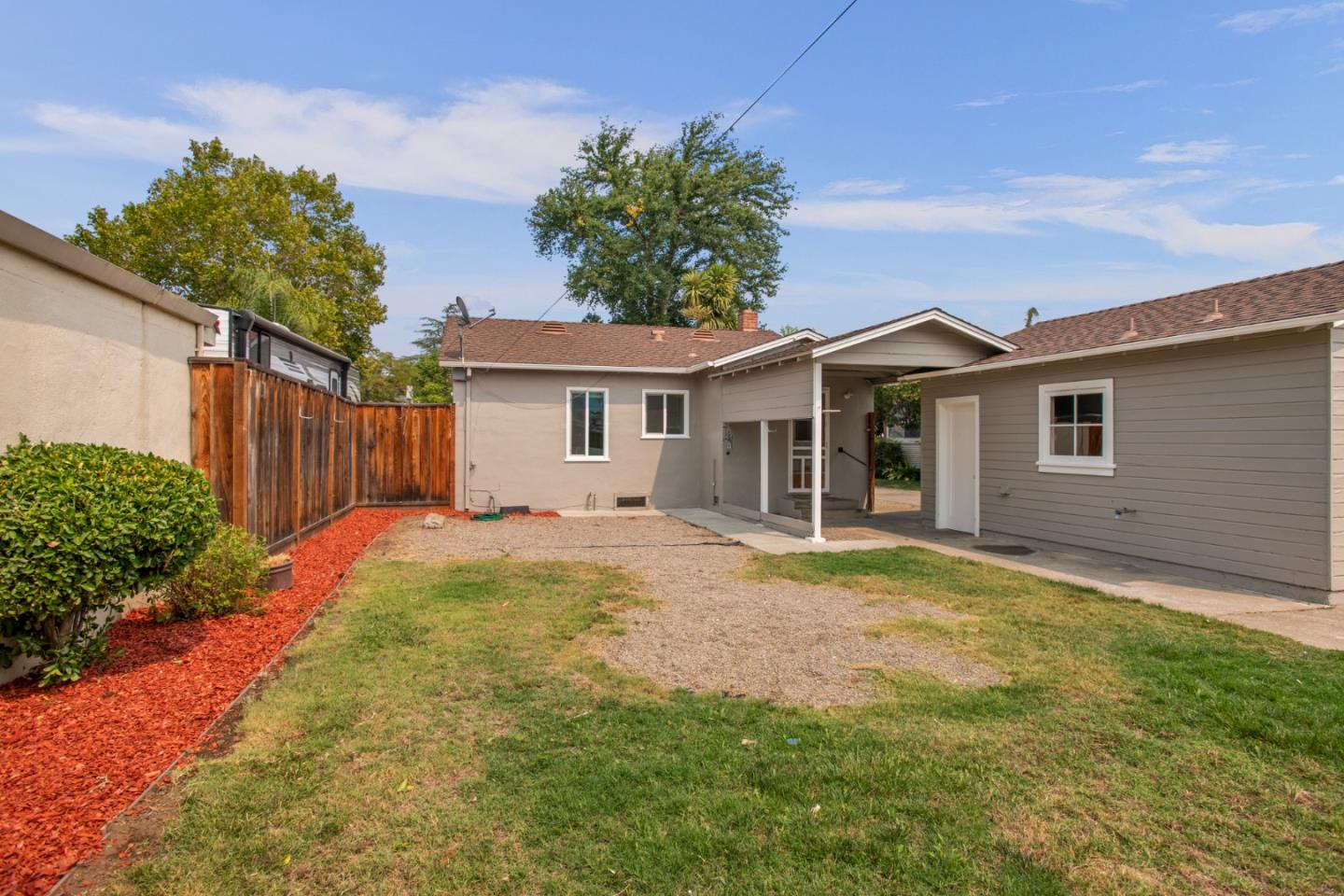 7449 Alexander Street Gilroy, CA 95020 - Photo 13 of 18 a view of a house with backyard and tree