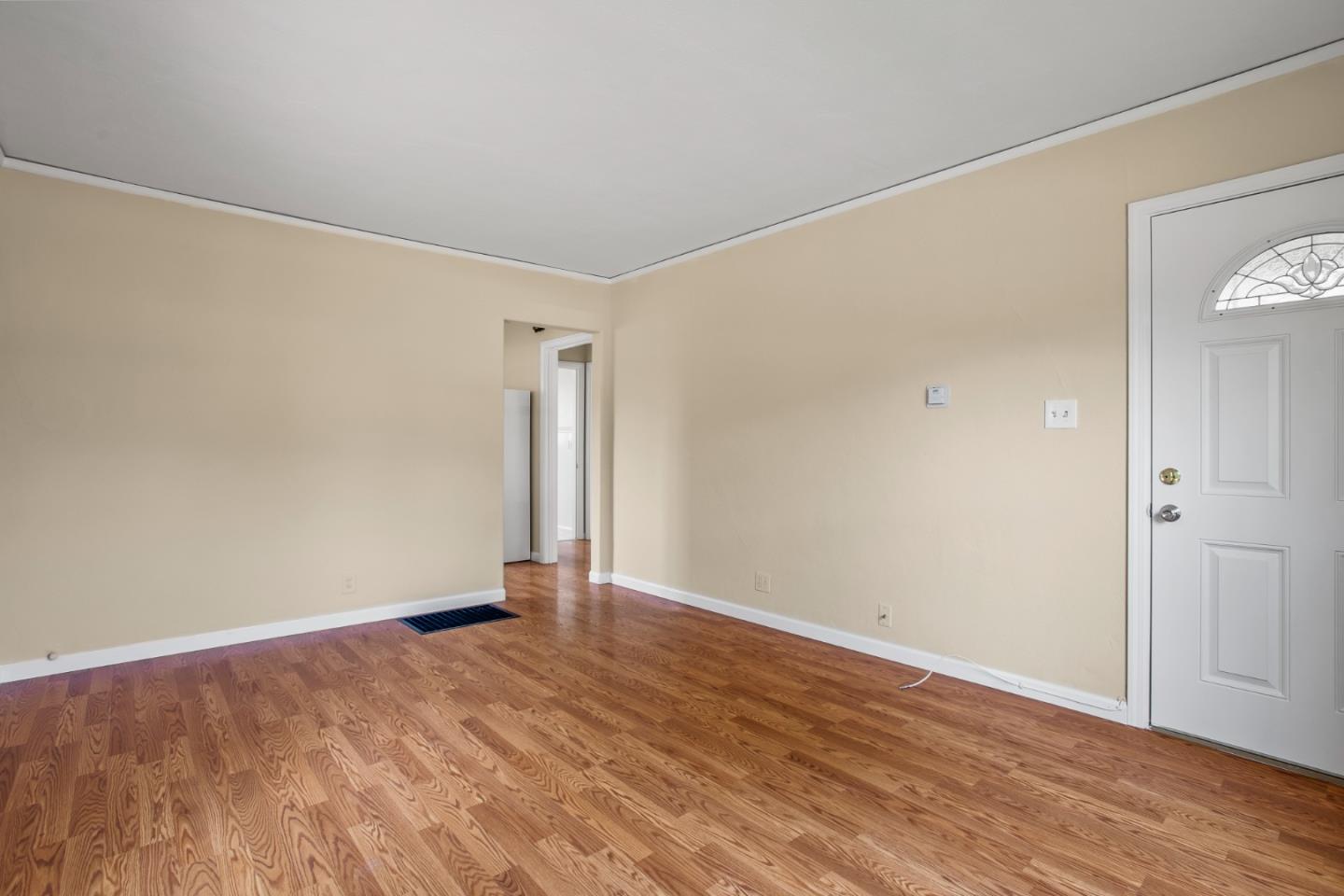 7449 Alexander Street Gilroy, CA 95020 - Photo 5 of 18 a view of an empty room with wooden floor