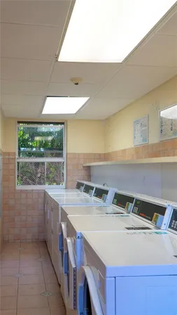 a kitchen with a sink and a window