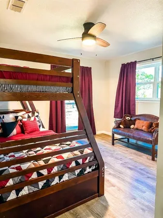 a view of a room with furniture and window