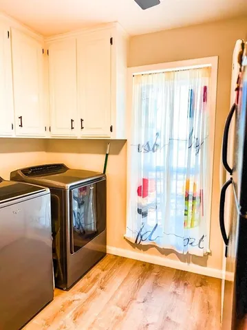 a view of a kitchen with a sink and a window