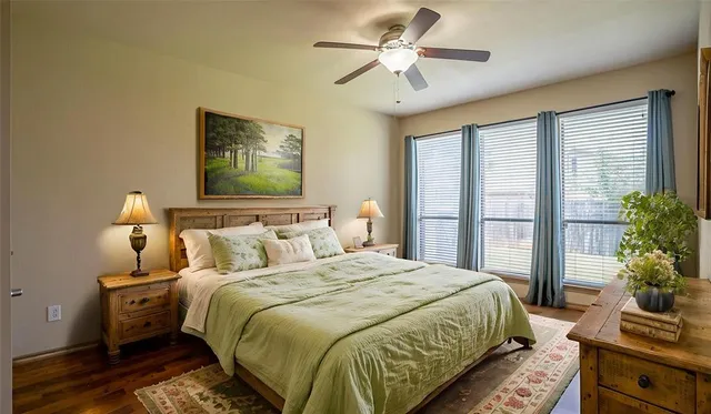 a bedroom with bed and windows