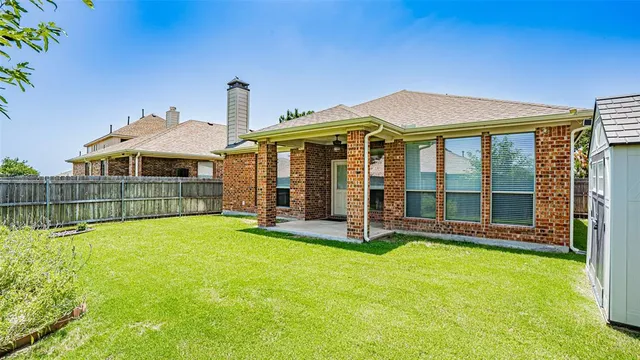 a front view of a house with yard