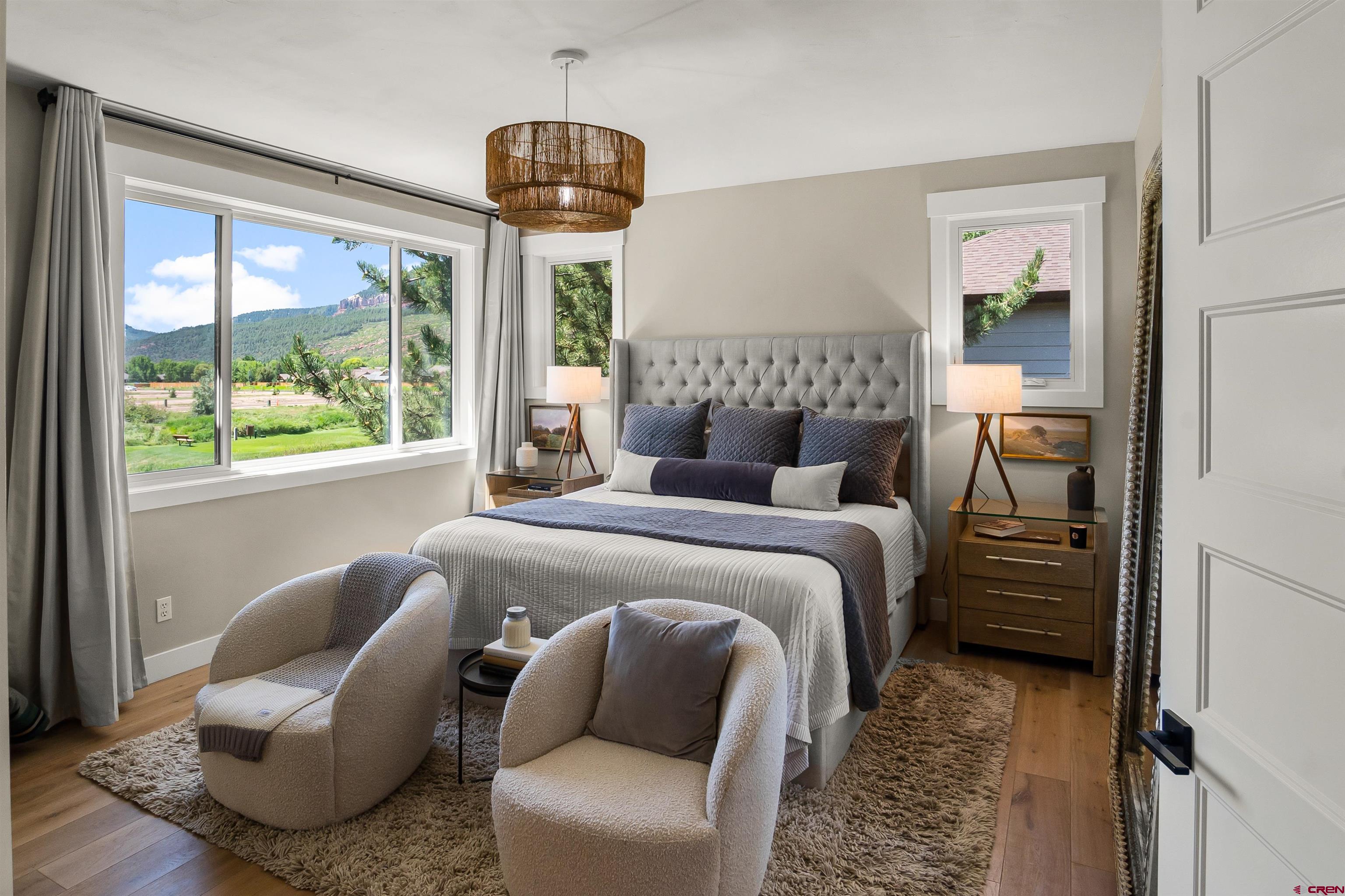 17 St Andrews Circle Durango, CO 81301 - Photo 11 of 28 a bedroom with furniture and a large window