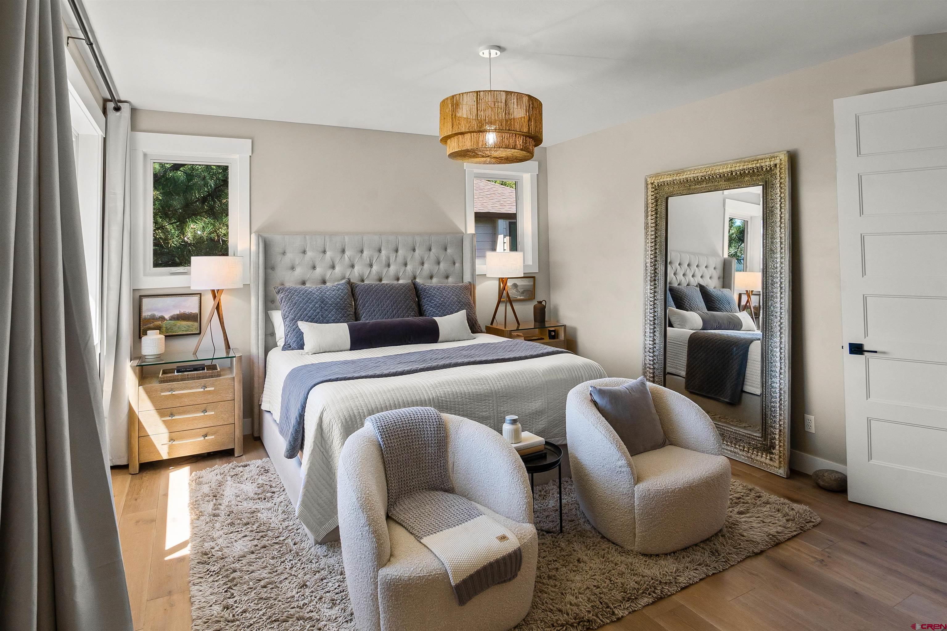 17 St Andrews Circle Durango, CO 81301 - Photo 12 of 28 a bedroom with furniture and a large window