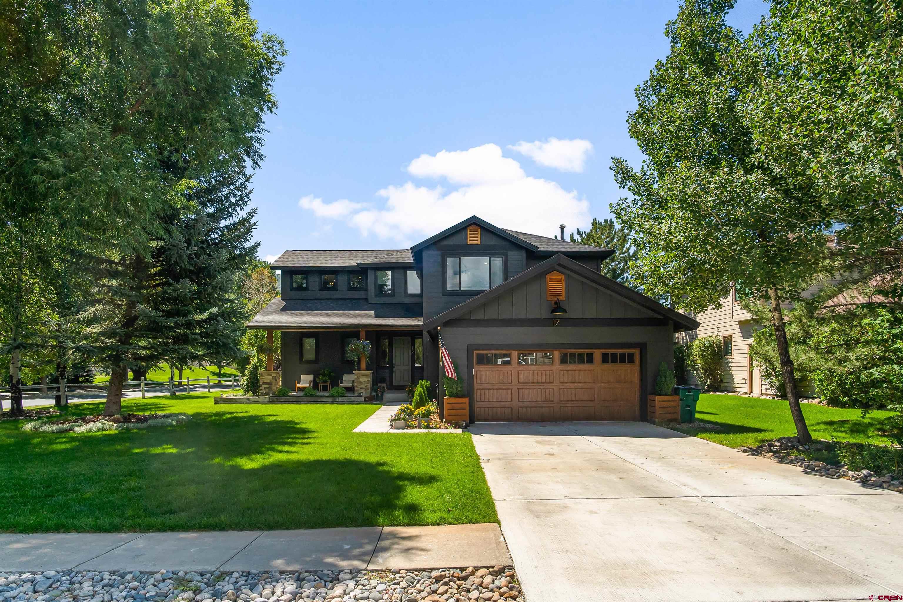 17 St Andrews Circle Durango, CO 81301 - Photo 24 of 28 a front view of a house with a garden