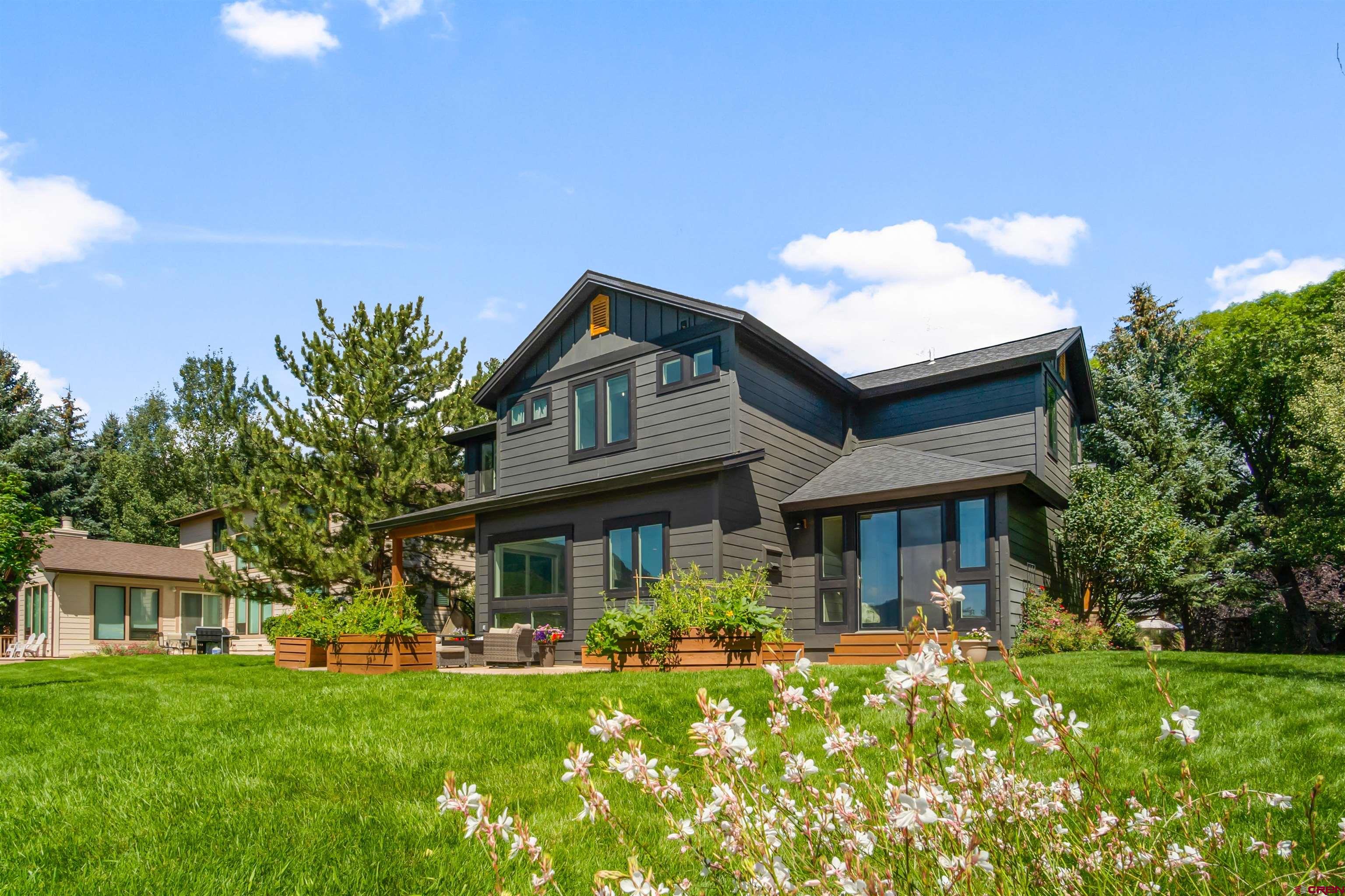17 St Andrews Circle Durango, CO 81301 - Photo 26 of 28 a front view of a house with swimming pool having outdoor seating