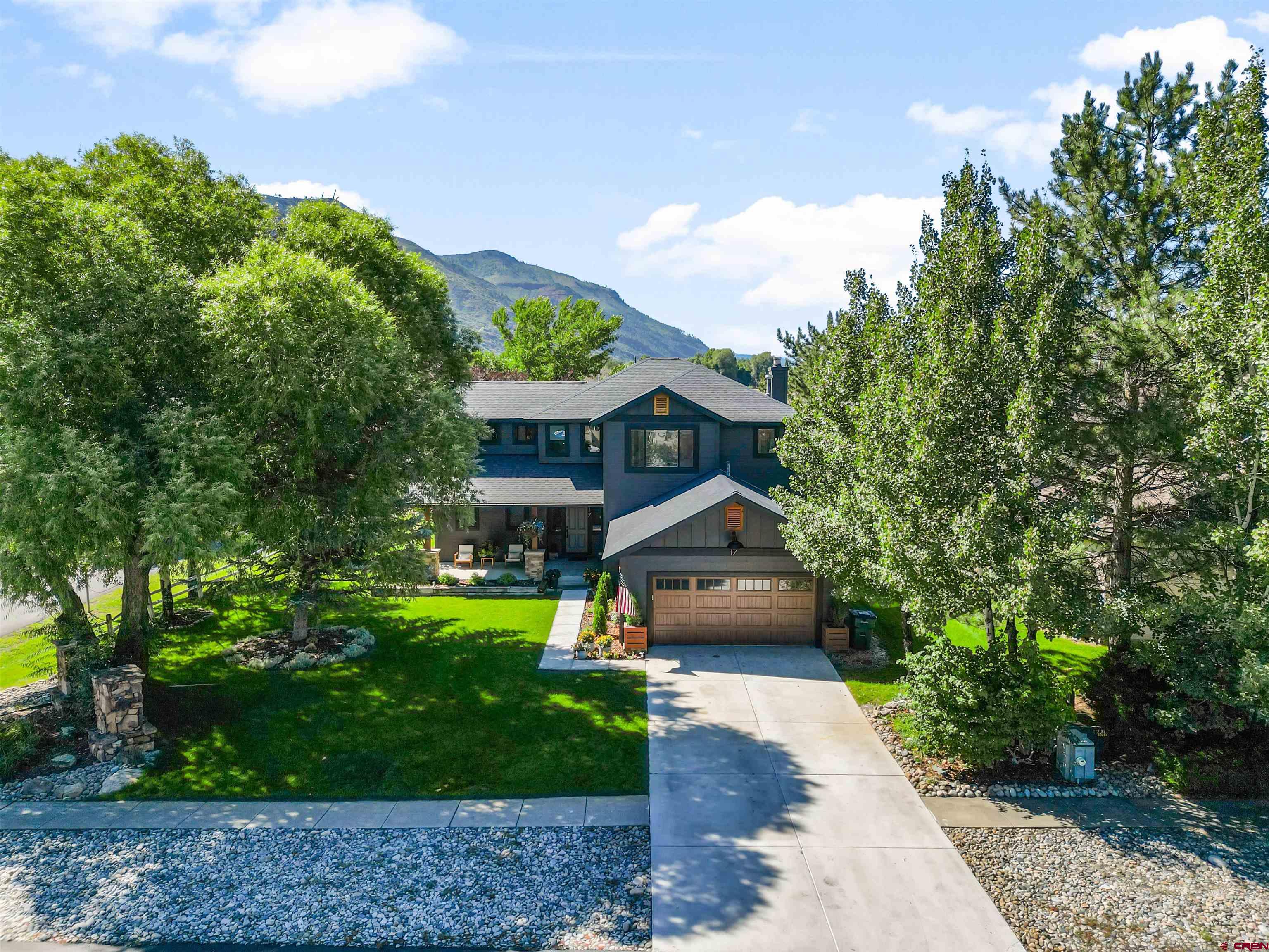 17 St Andrews Circle Durango, CO 81301 - Photo 4 of 28 a front view of a house with garden