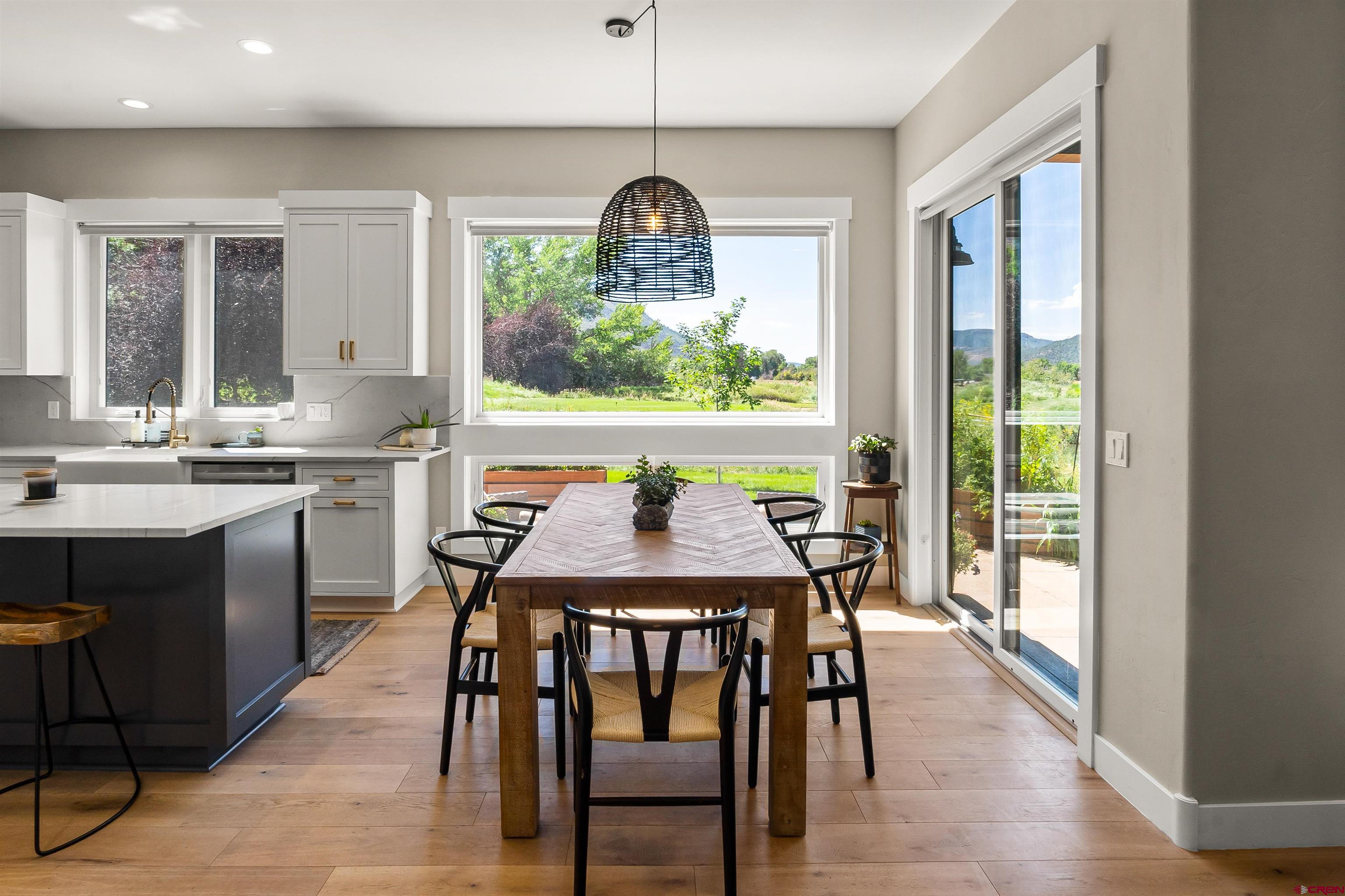17 St Andrews Circle Durango, CO 81301 - Photo 8 of 28 a dining room with furniture a chandelier and wooden floor