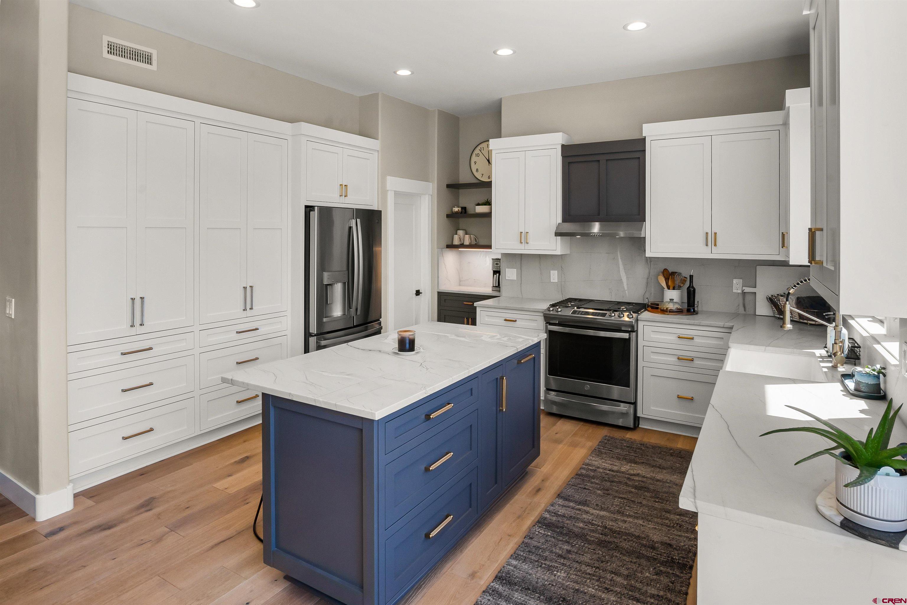 17 St Andrews Circle Durango, CO 81301 - Photo 10 of 28 a kitchen with stainless steel appliances a stove refrigerator sink and cabinets