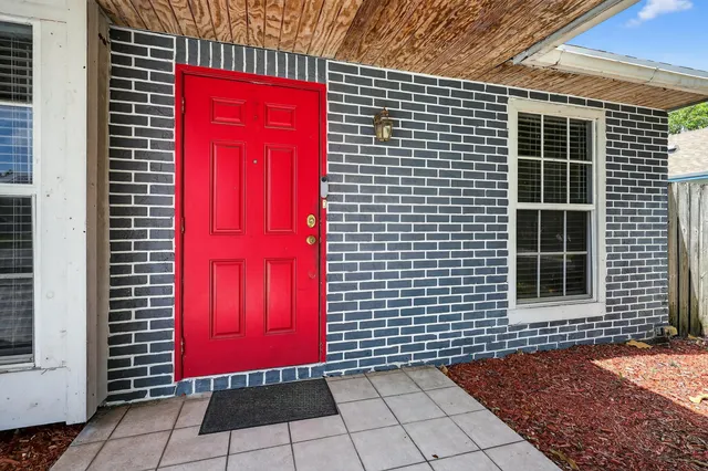 a view of a house with red door