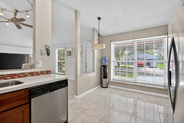 a open kitchen with stainless steel appliances a stove sink and cabinets