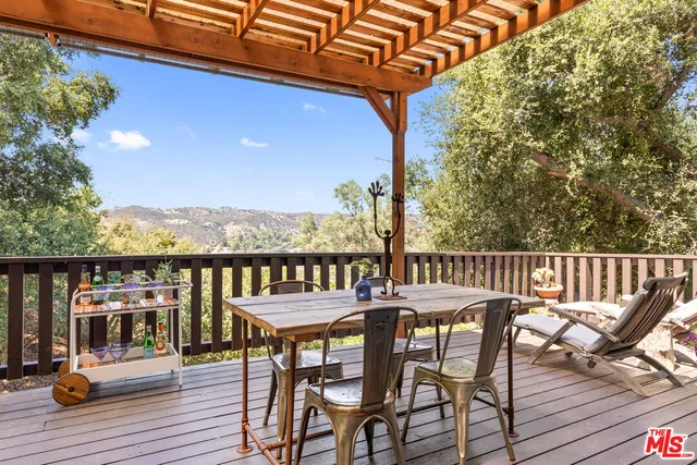 a view of a chairs and table on the wooden floor