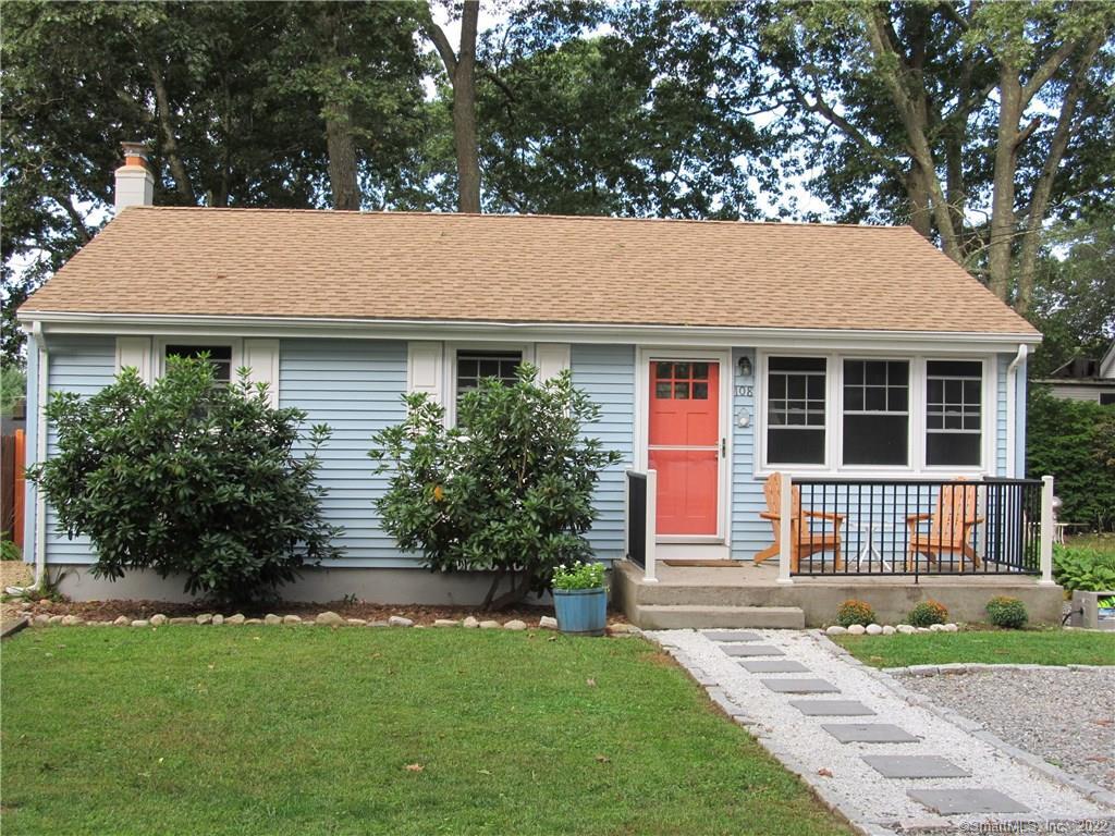108 Hillcrest Road East Lyme, CT 06357 - Photo 1 of 1 a backyard of a house with potted plants and large tree
