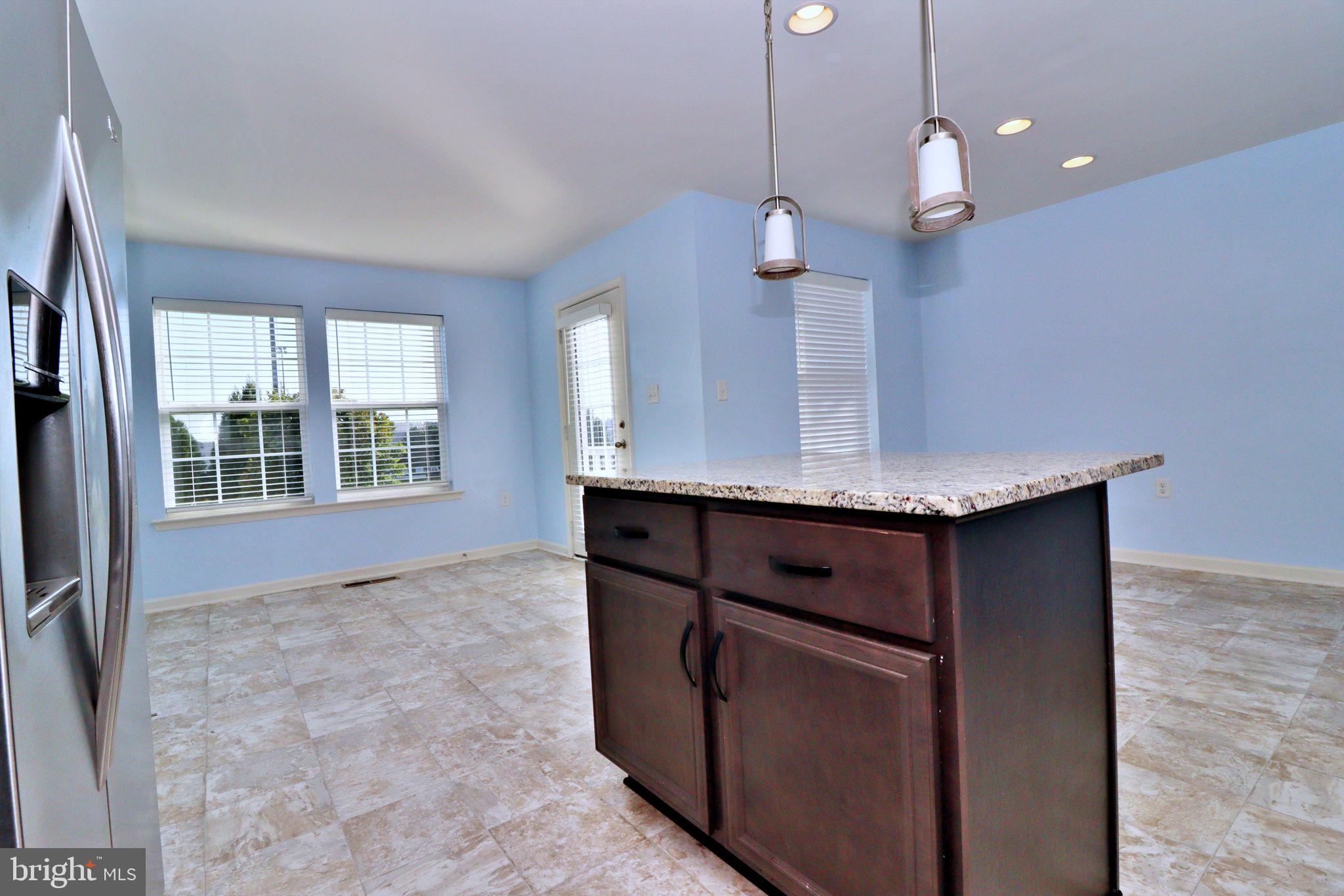 605 Thumper Drive Ranson, WV 25438 - Photo 27 of 47 Open Kitchen with Island