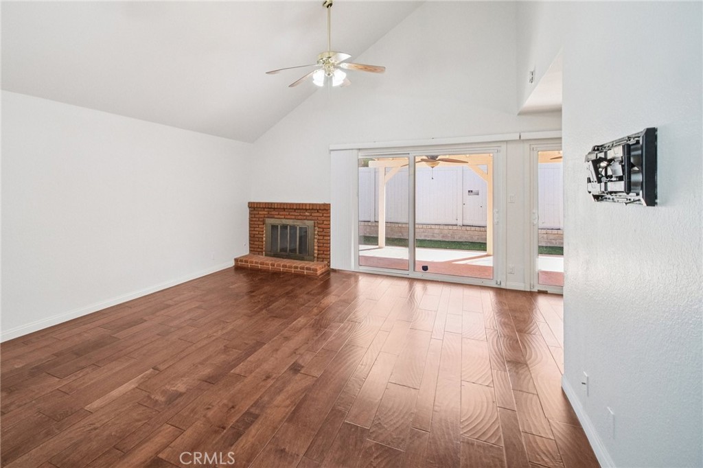 22810 Rio Chico Drive Valencia, CA 91354 - Photo 14 of 60 an empty room with wooden floor and windows