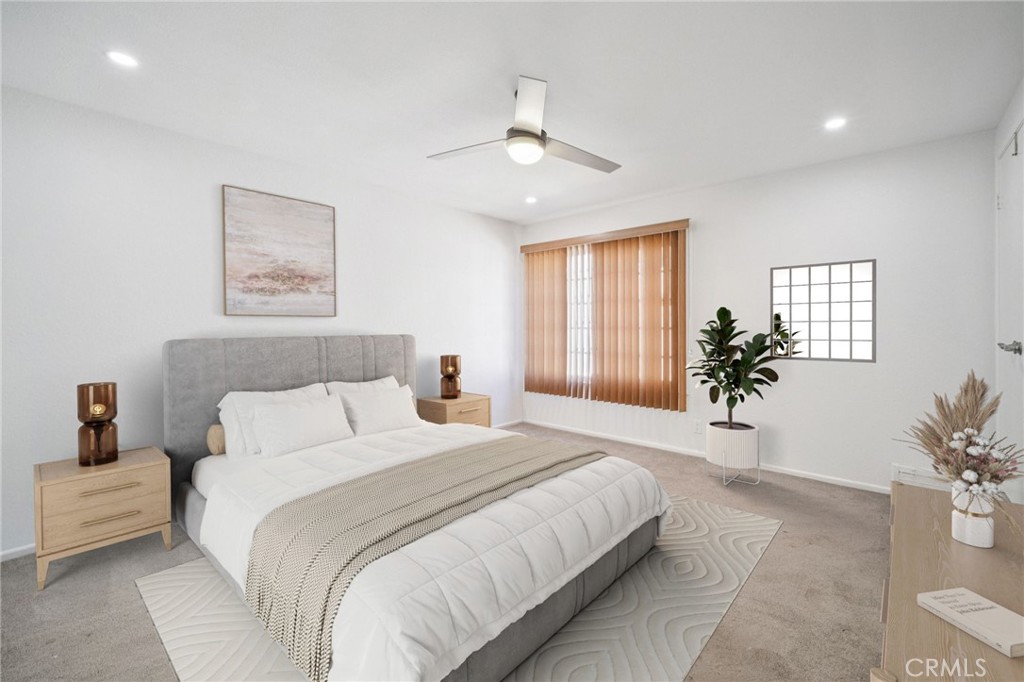 22810 Rio Chico Drive Valencia, CA 91354 - Photo 22 of 60 a bedroom with a large bed and a chandelier