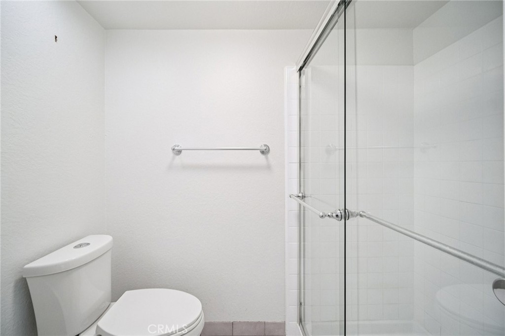 22810 Rio Chico Drive Valencia, CA 91354 - Photo 29 of 60 a white toilet sitting next to a shower
