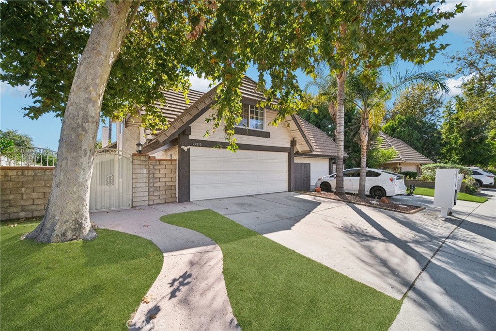 22810 Rio Chico Drive Valencia, CA 91354 - Photo 3 of 60 a view of a house with backyard and a tree