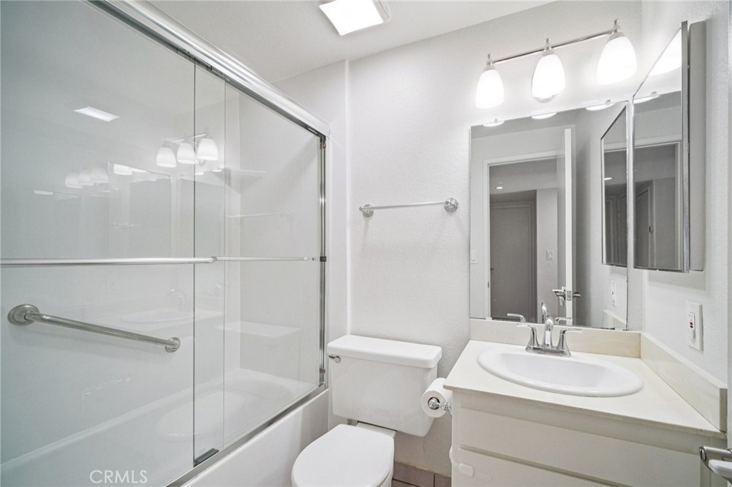 22810 Rio Chico Drive Valencia, CA 91354 - Photo 33 of 60 a bathroom with a sink a toilet and shower