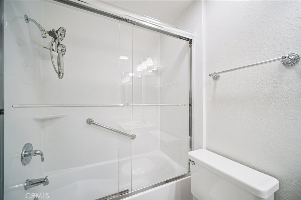 22810 Rio Chico Drive Valencia, CA 91354 - Photo 35 of 60 a bathroom with a shower a toilet and sink