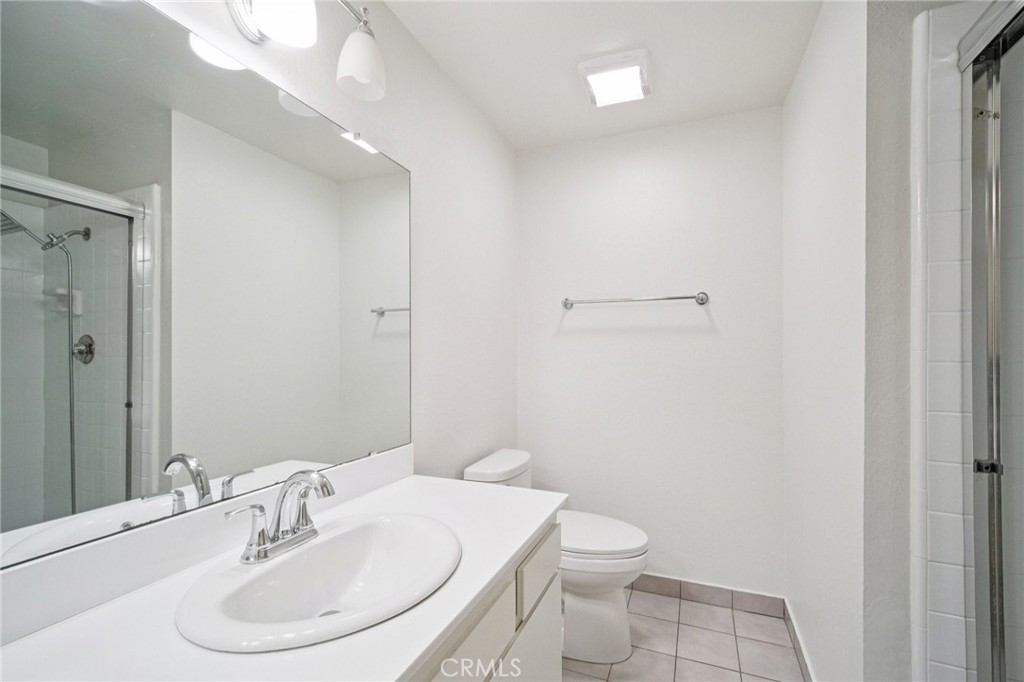 22810 Rio Chico Drive Valencia, CA 91354 - Photo 52 of 60 a bathroom with a sink toilet and vanity