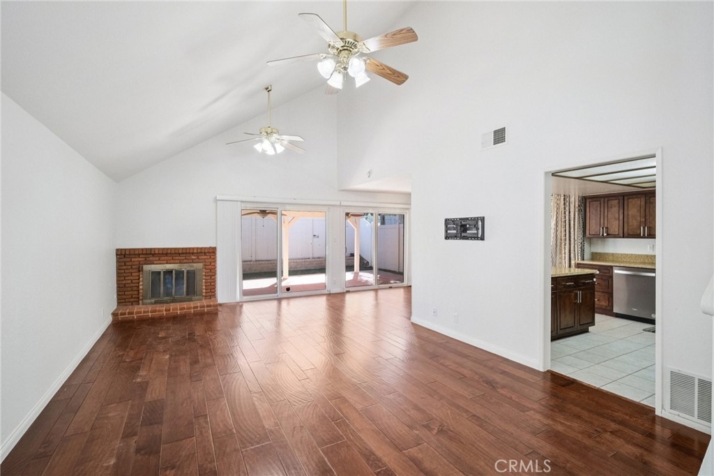 22810 Rio Chico Drive Valencia, CA 91354 - Photo 10 of 60 a view of an empty room with window and wooden floor