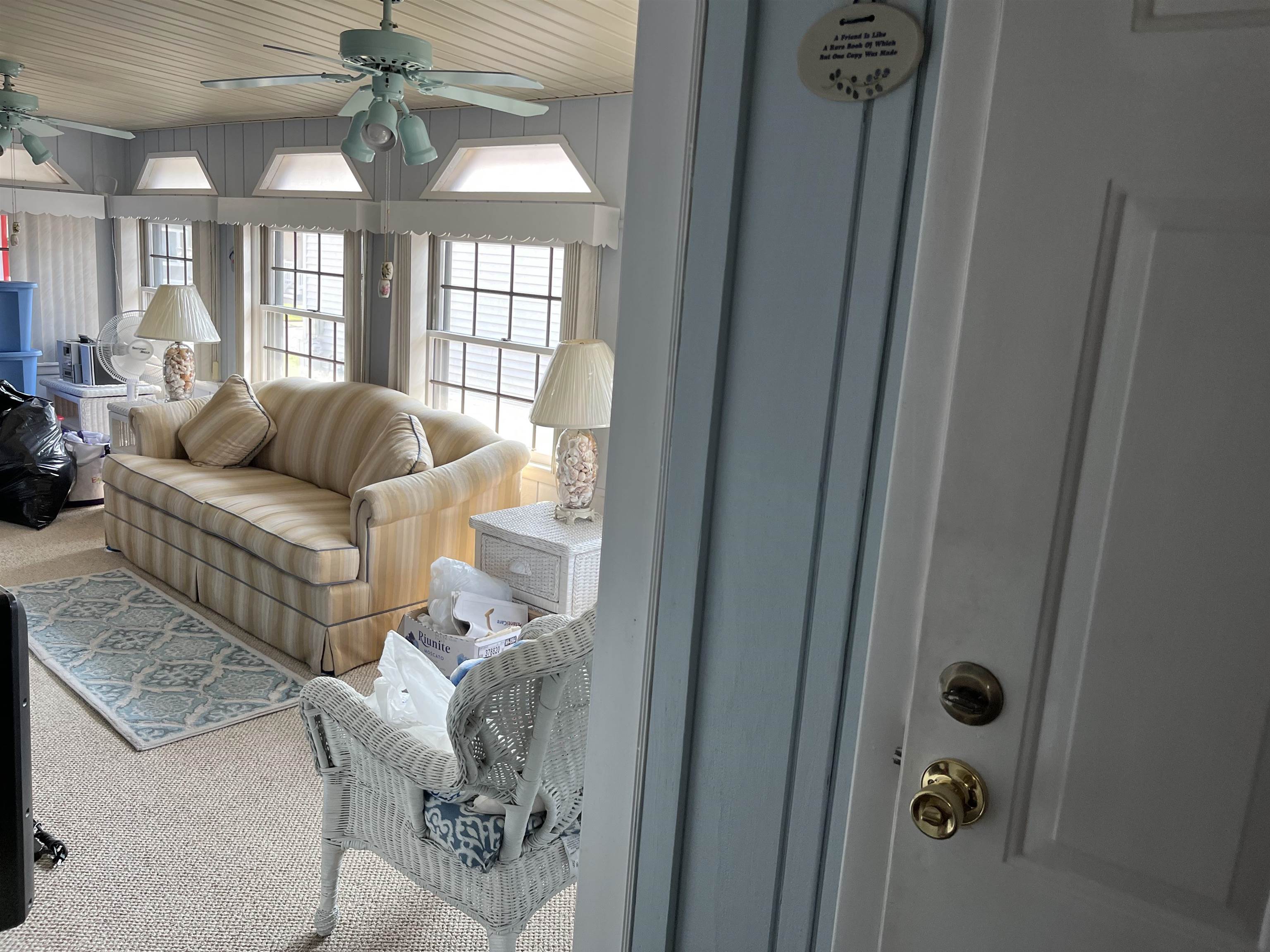 301 Grande Rio Grande, NJ 08242 - Photo 19 of 23 a living room with furniture and a chandelier