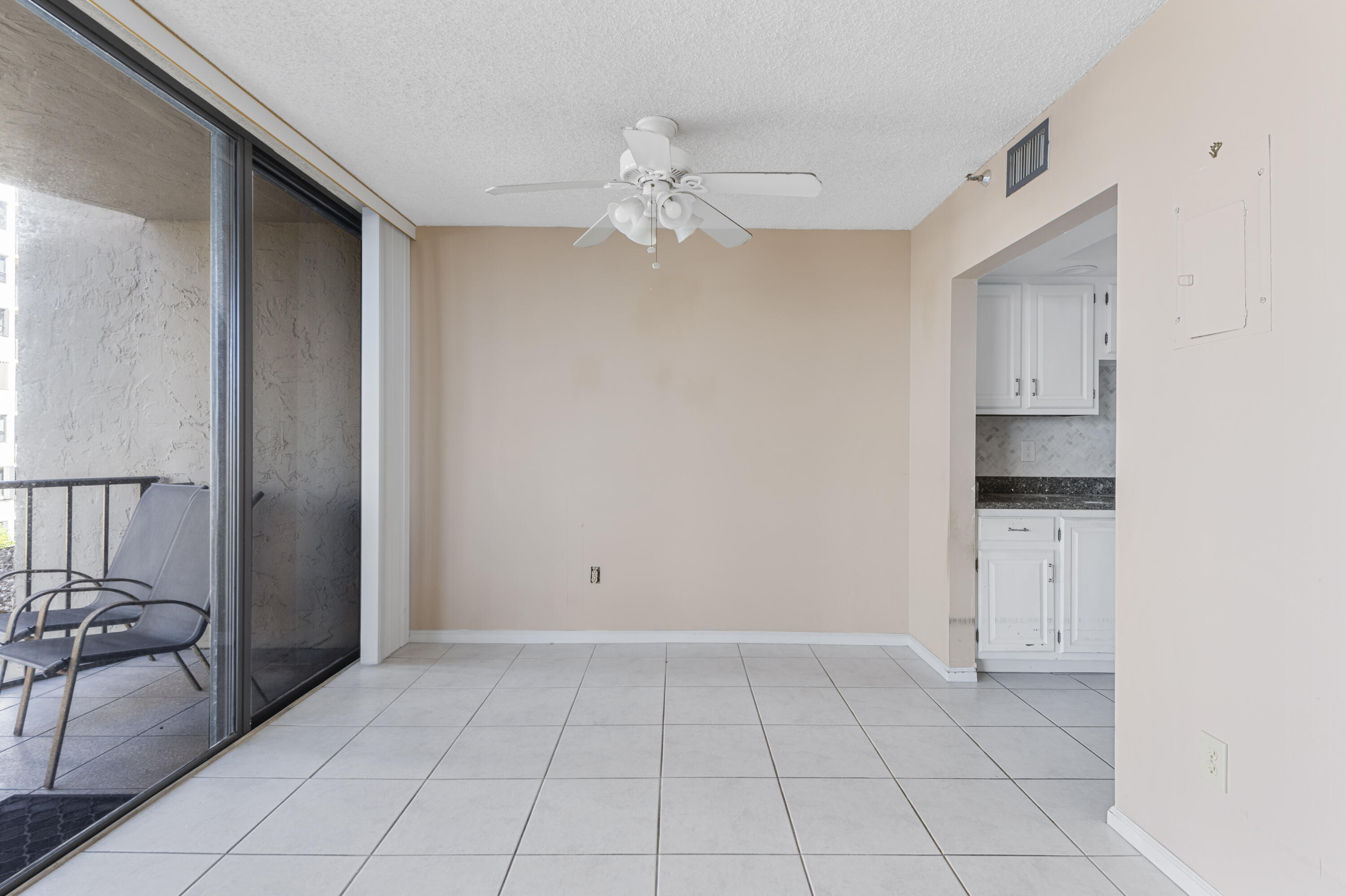 859 Jeffery Street, Unit 312 Boca Raton, FL 33487 - Photo 5 of 53 a view of an empty room with a fireplace and a window