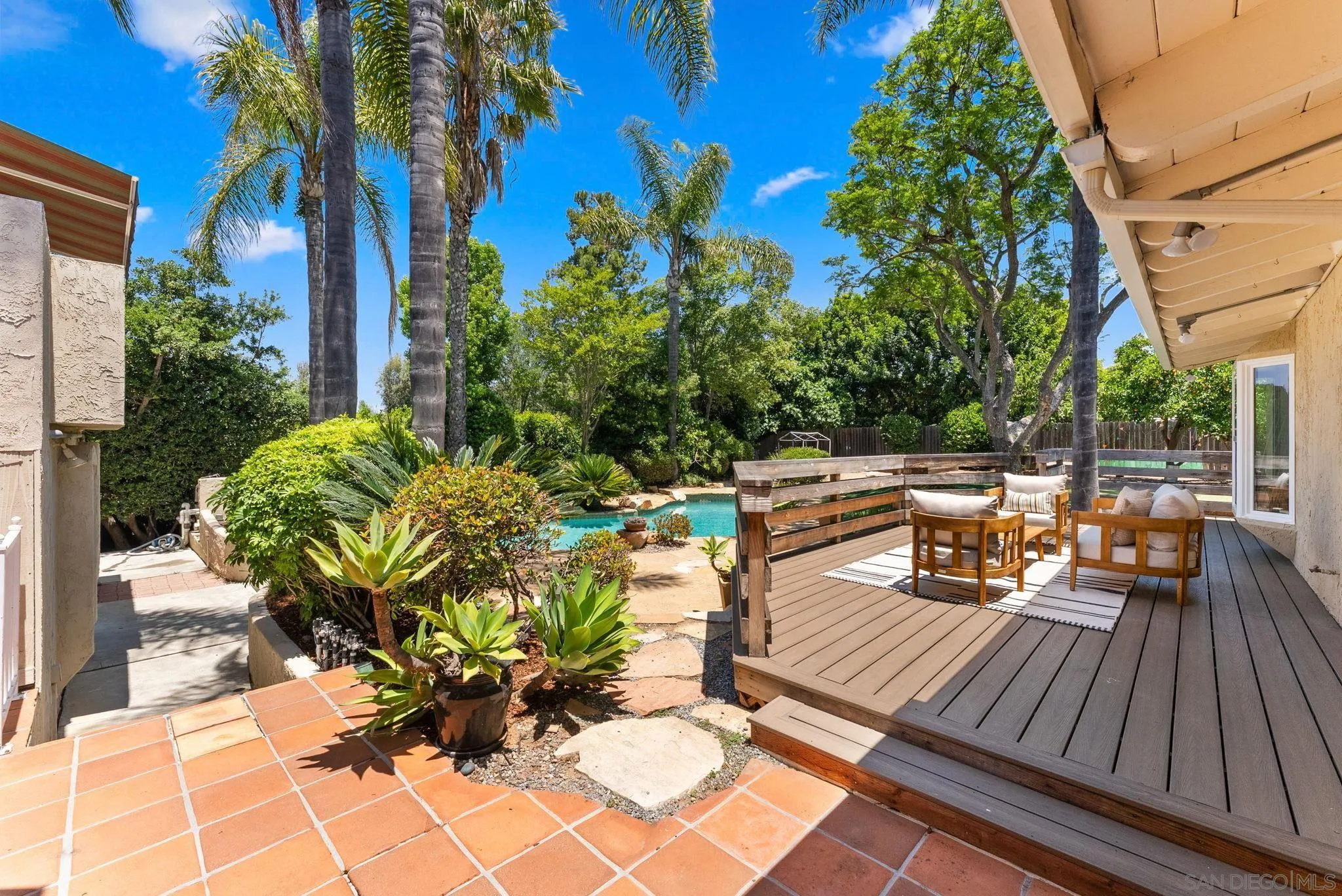 12832 Stone Canyon Road Poway, CA 92064 - Photo 33 of 60 a view of a chairs and table on the terrace