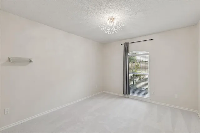 an empty room with a empty space and windows