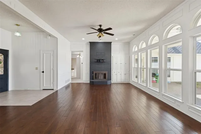 a view of an empty room and wooden floor