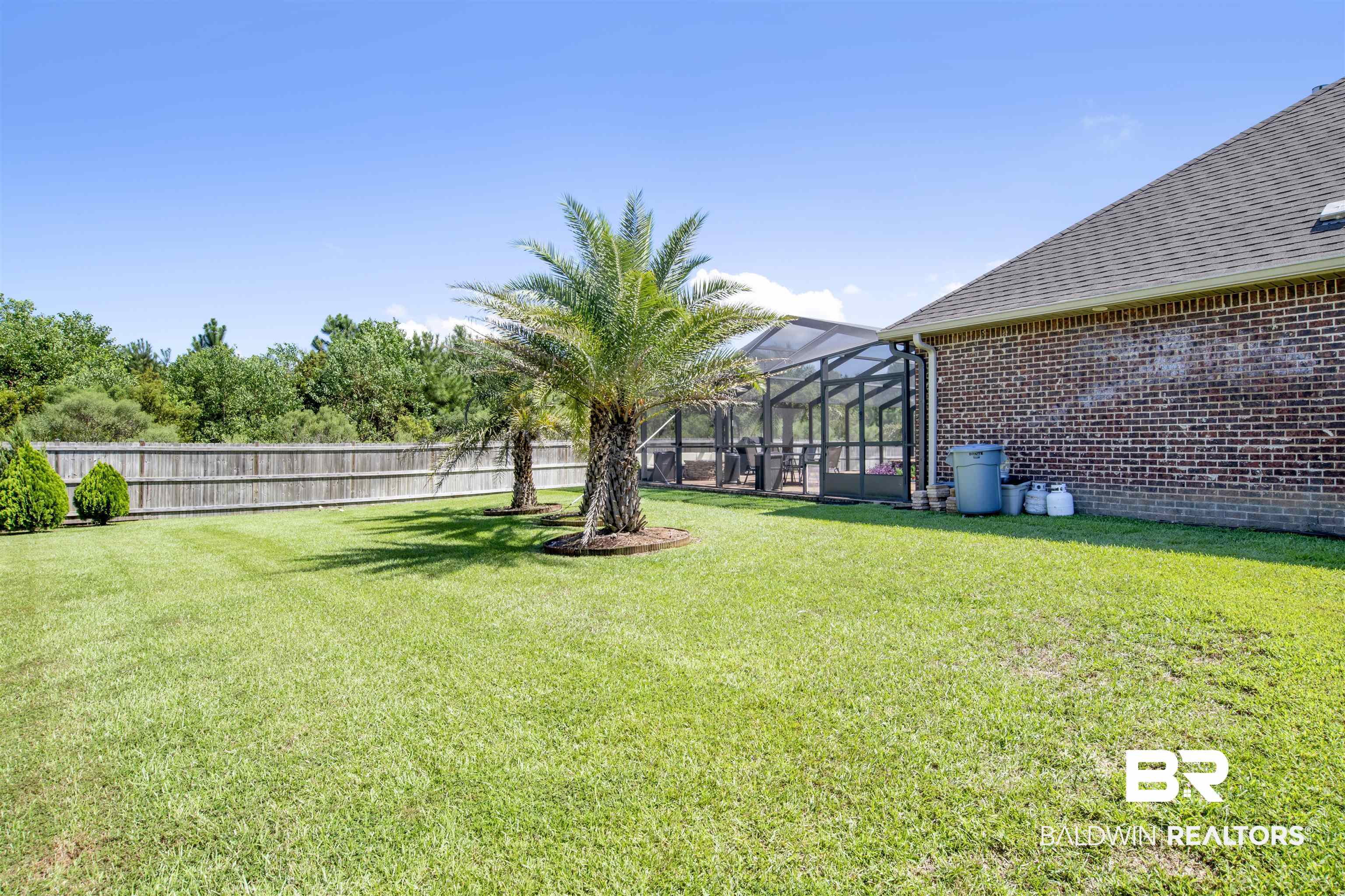 4196 Inverness Circle Gulf Shores, AL 36542 - Photo 41 of 43 View of yard with glass enclosure
