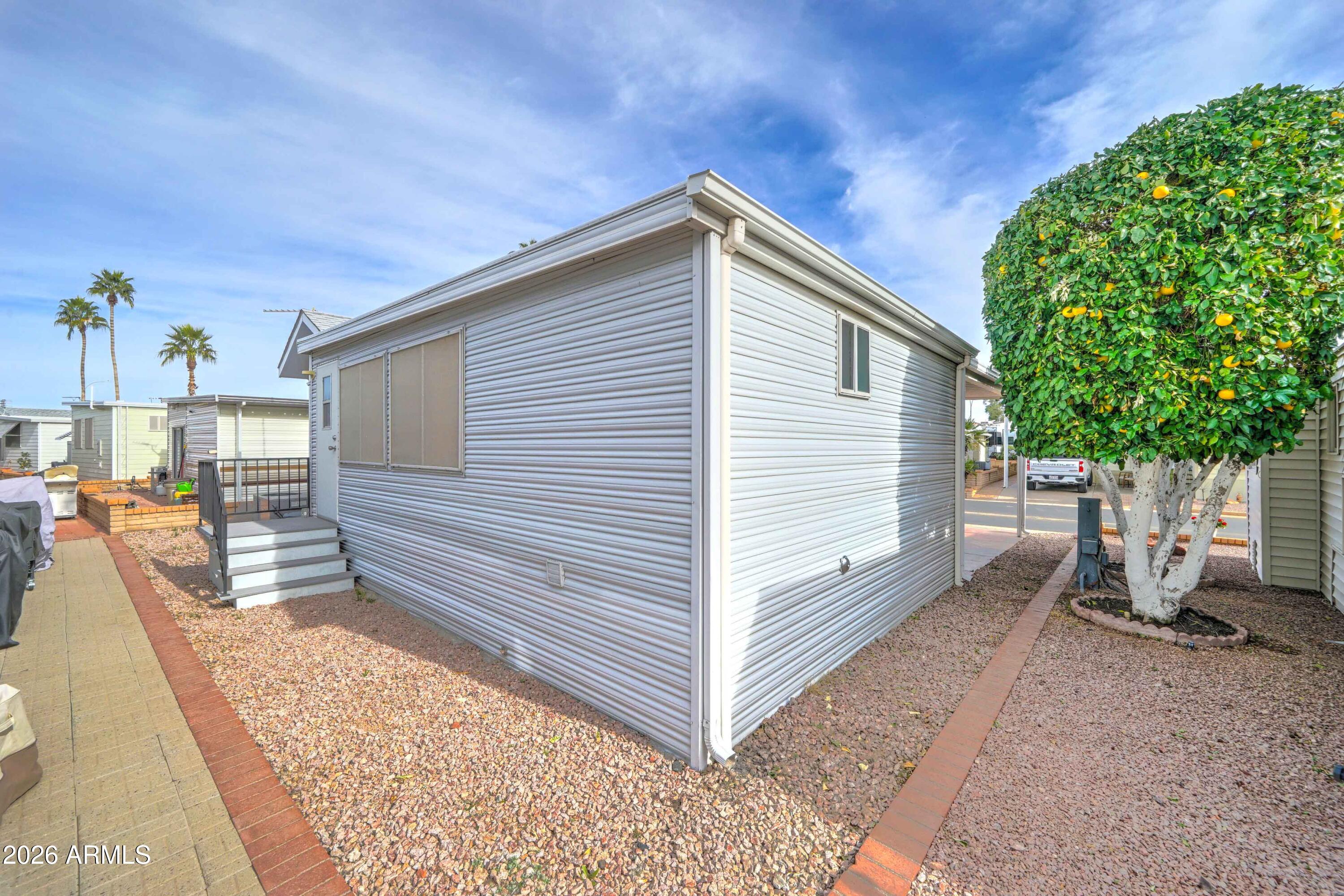 111 South Greenfield Road, Unit 520 Mesa, AZ 85206 - Photo 15 of 28 a view of a backyard with sitting area