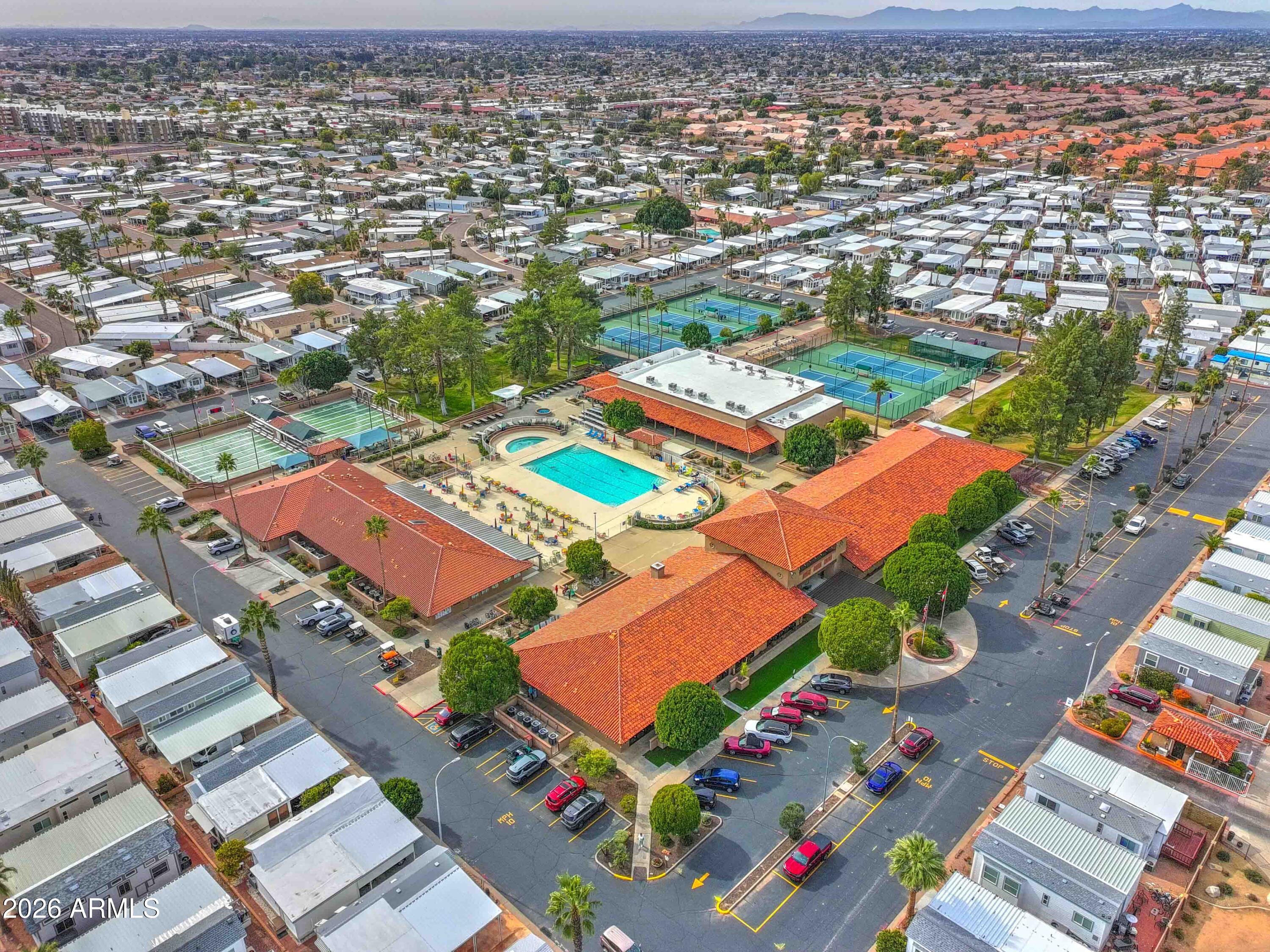 111 South Greenfield Road, Unit 520 Mesa, AZ 85206 - Photo 18 of 28 an aerial view of residential houses with outdoor space