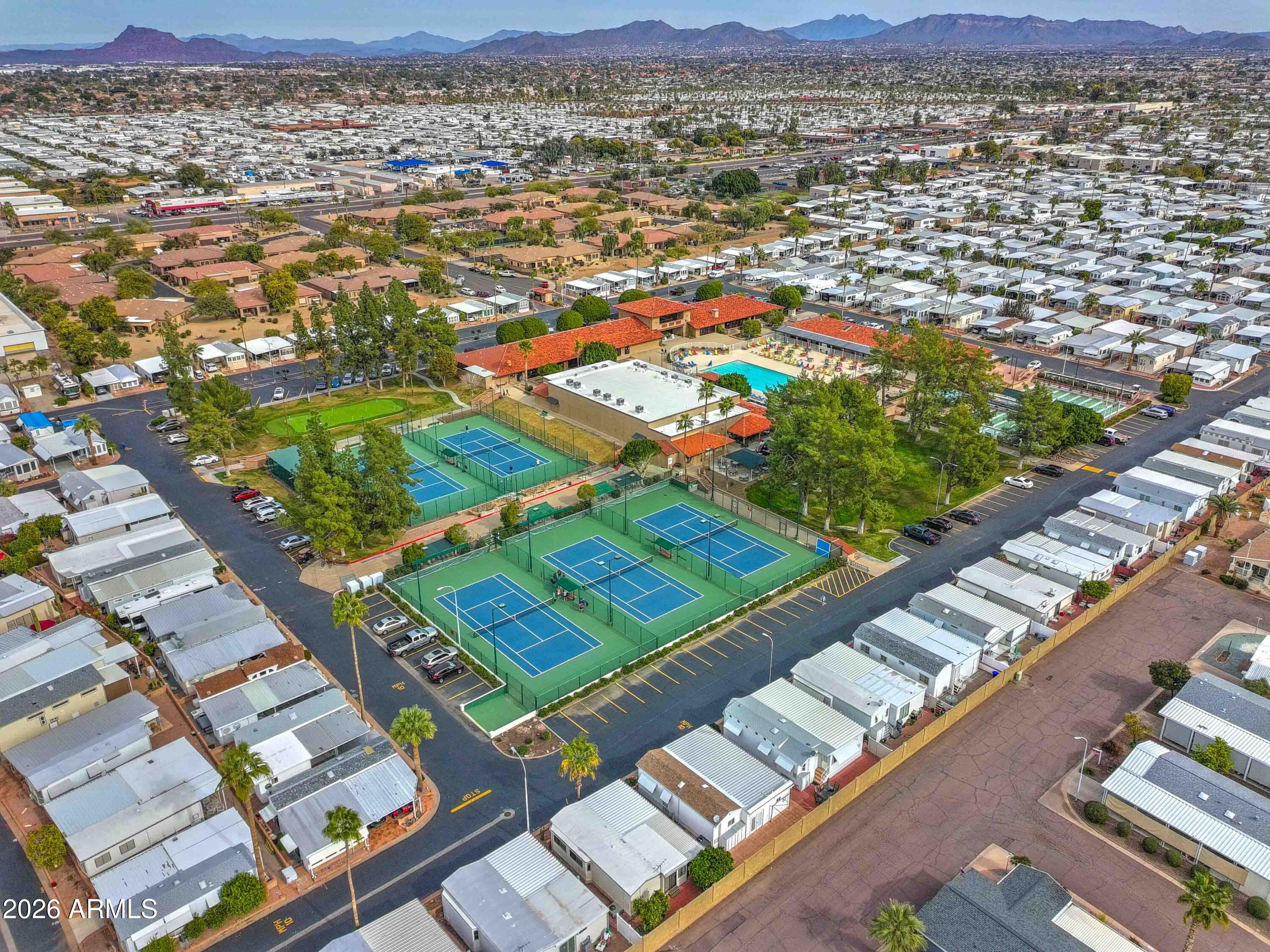 111 South Greenfield Road, Unit 520 Mesa, AZ 85206 - Photo 21 of 28 an aerial view of residential houses with outdoor space