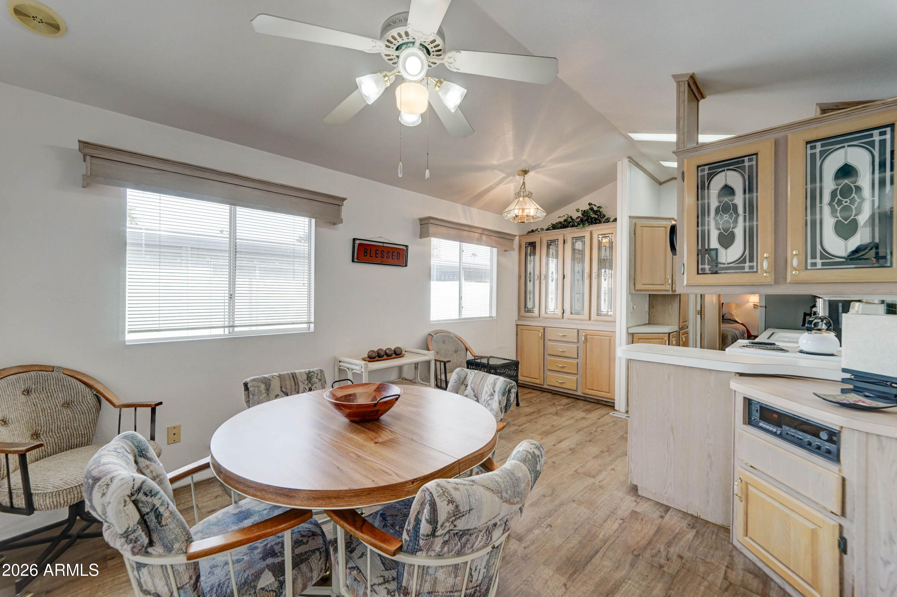 111 South Greenfield Road, Unit 520 Mesa, AZ 85206 - Photo 9 of 28 a dining room with furniture and window
