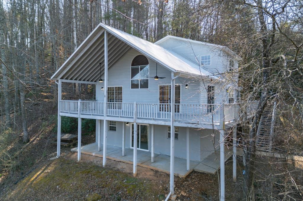 144 River Watch Terrace Murphy, NC 28906 - Photo 1 of 60 a view of house with a yard and large trees