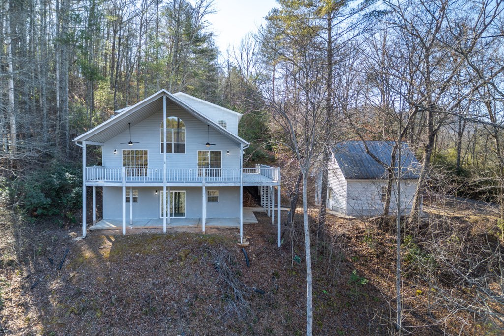 144 River Watch Terrace Murphy, NC 28906 - Photo 2 of 60 a view of a house with a yard and large trees