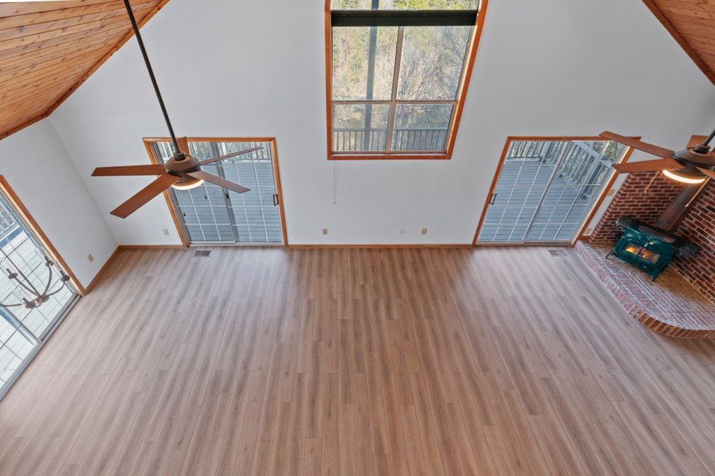144 River Watch Terrace Murphy, NC 28906 - Photo 24 of 60 a view of an empty room with wooden floor and a window