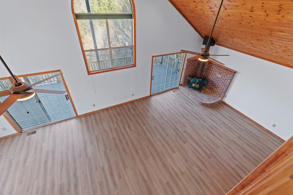 144 River Watch Terrace Murphy, NC 28906 - Photo 25 of 60 a view of an empty room with wooden floor and stairs